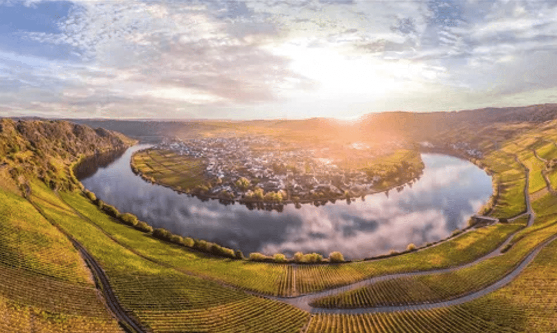 View over Piesport on the Mosel River, with the steep Piesporter Goldtröpfchen vineyards rising around the village.